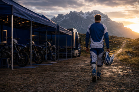 Editorial illustration of a factory enduro rider leaving a race paddock for a mountain trail